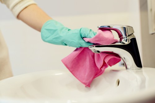 Professional cleaner in SW18 maintaining a spotless home interior